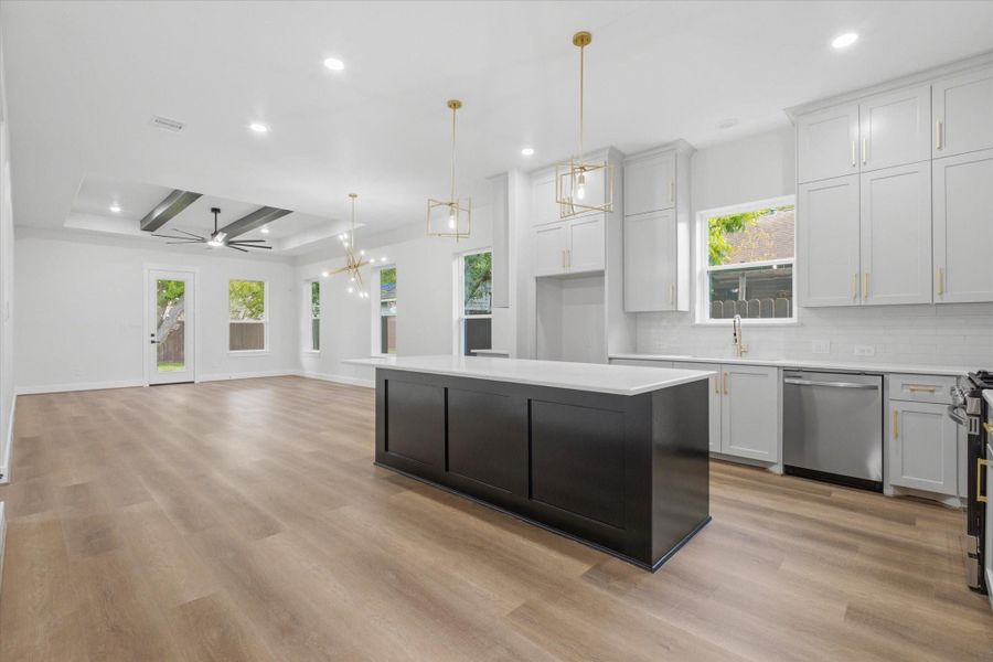 A bold black island adds the perfect pop and plenty of extra seating. Pendant lighting sets the vibe, and the floor-to-ceiling cabinets bring just the right hint of sophistication. A bold black island adds the perfect pop and plenty of extra seating. Pendant lighting sets the vibe, and the floor-to-ceiling cabinets bring just the right hint of sophistication.