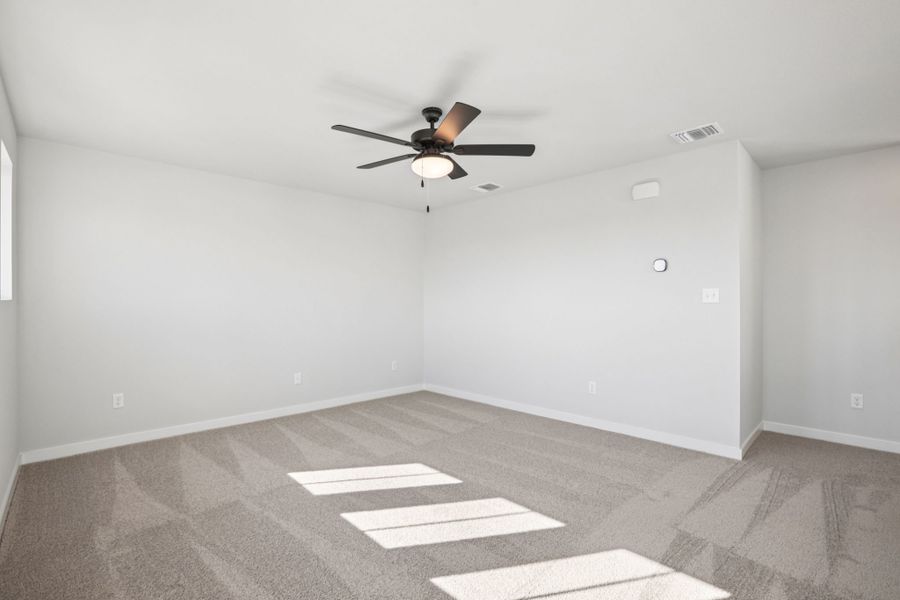 A ceiling fan in a room.