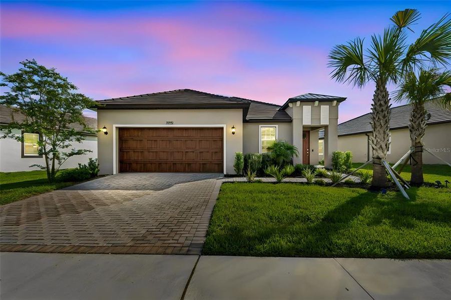 Front exterior of a new home in Mirada Active Adult, San Antonio, FL, highlighting curb appeal (Image 22).