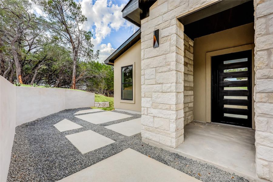 Property entrance featuring stone siding Property entrance featuring stone siding