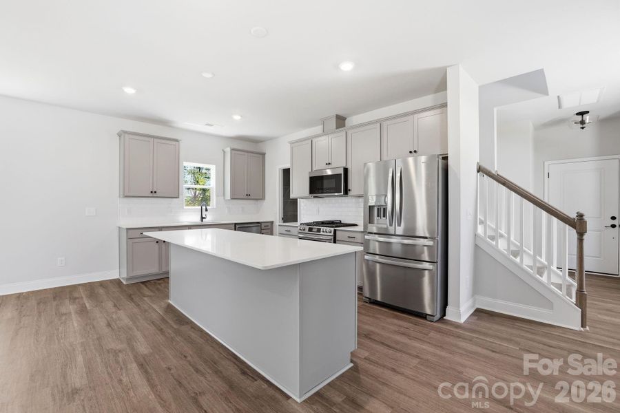 Quartz counters, walk in pantry and large island Quartz counters, walk in pantry and large island