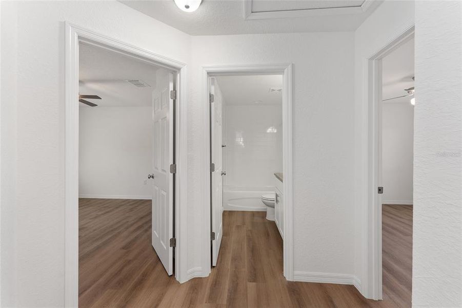 Hallway to guest bedrooms and hall bath