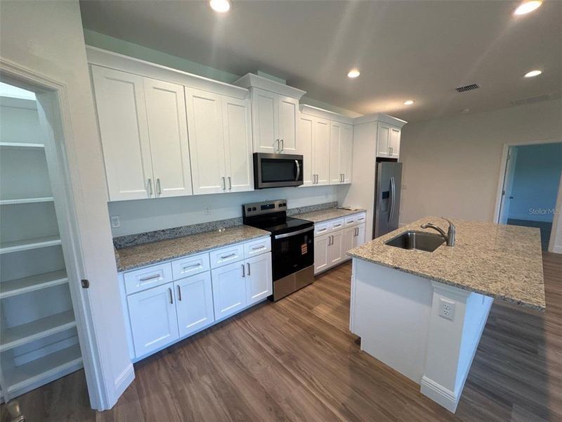 Furnished interior view inside a new home in , Apopka (Image 4).