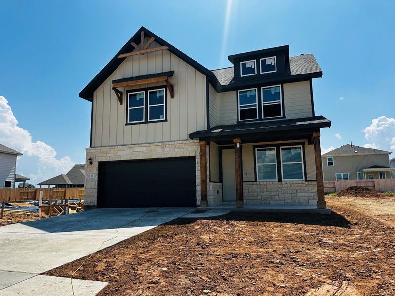 Front exterior of a new home in Patterson Ranch, Georgetown, TX, highlighting curb appeal (Image 8).