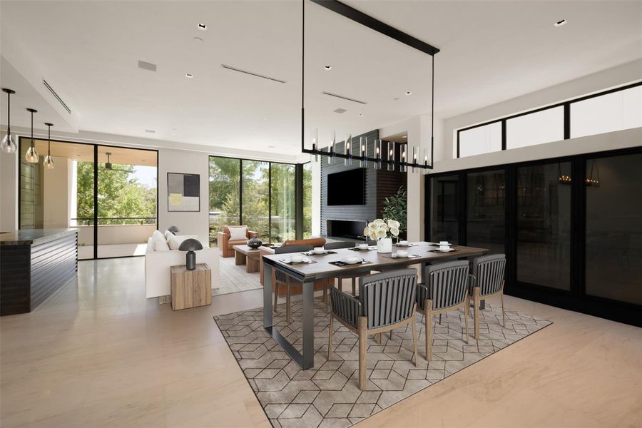Dining space featuring plenty of natural light, a fireplace, and floor to ceiling windows, virtually staged