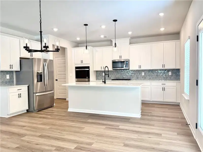 Furnished interior view inside a new home in Vines at Mill Creek - Estate Series, Braselton (Image 9). Furnished interior view inside a new home in Vines at Mill Creek - Estate Series, Braselton (Image 9).