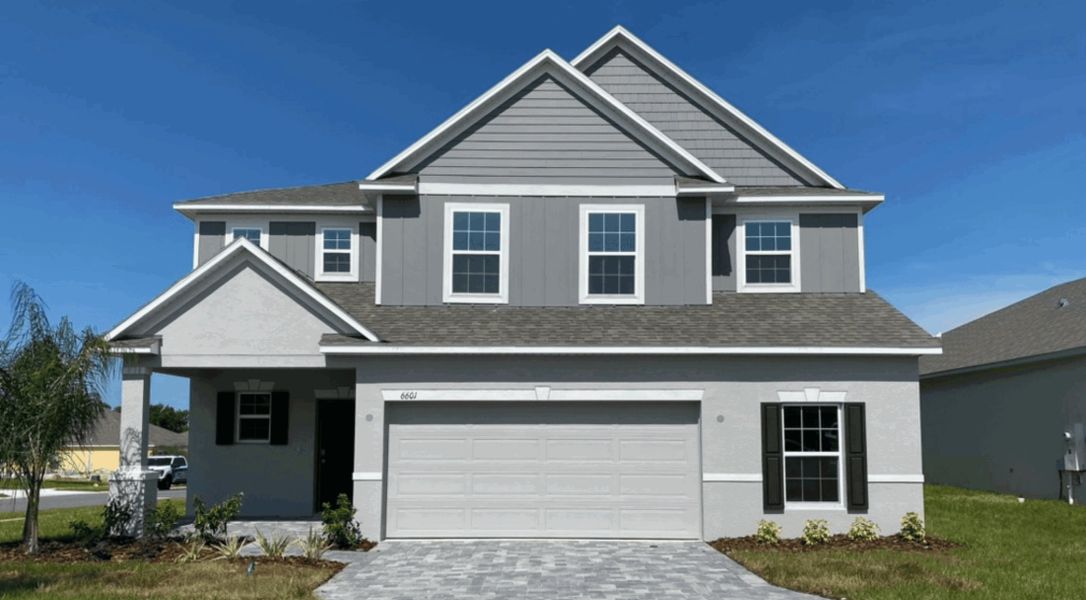 Representative exterior photo of a completed home built from the Columbus by Maronda Homes in Malabar Springs, Palm Bay, FL (Image 25). Representative exterior photo of a completed home built from the Columbus by Maronda Homes in Malabar Springs, Palm Bay, FL (Image 25).