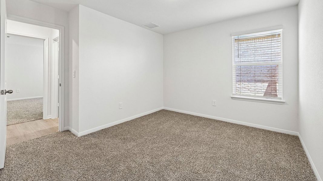 Spacious, unfurnished interior of a new home in Bar W Ranch, Leander (Image 27).
