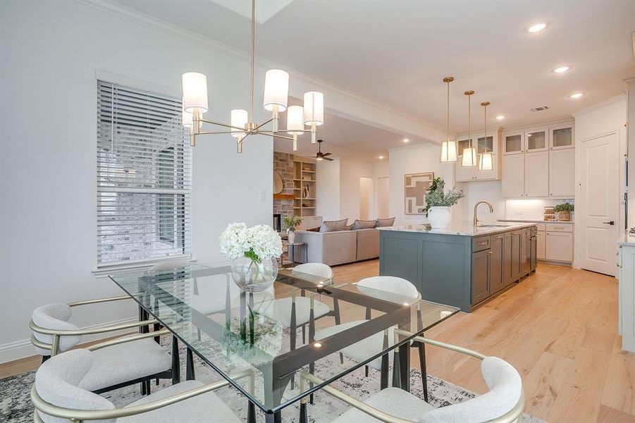 Dining area with decorative chandelier Dining area with decorative chandelier