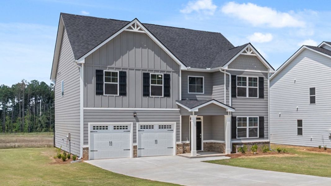 Front exterior of a new home in Oakchase at Hampton, Hampton, GA, highlighting curb appeal (Image 2).