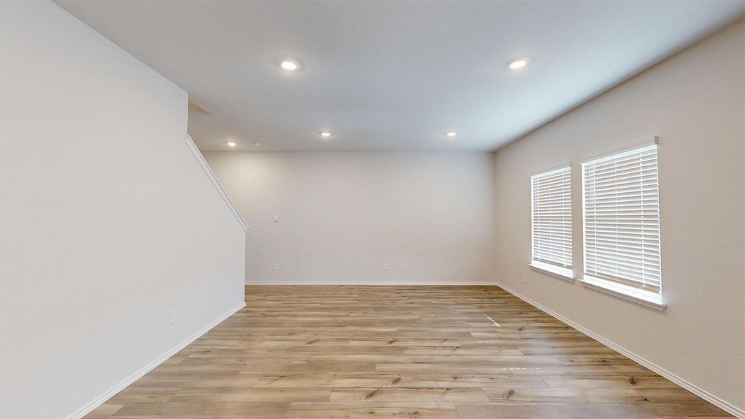 Unfurnished room featuring light wood-style flooring and recessed lighting