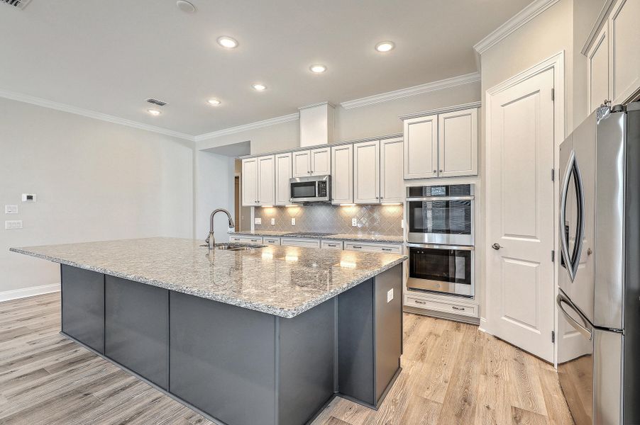 Furnished interior view inside a new home in K. Hovnanian's® Four Seasons at Lakes of Cane Bay, Summerville (Image 6).
