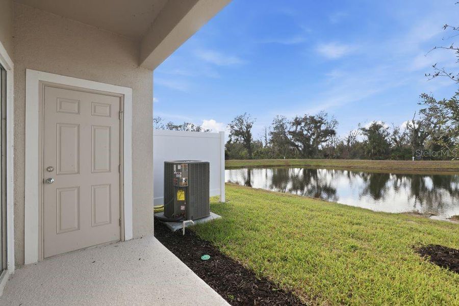 Exterior details and patio area of a home in The Towns at Firethorn, Parrish (Image 4).