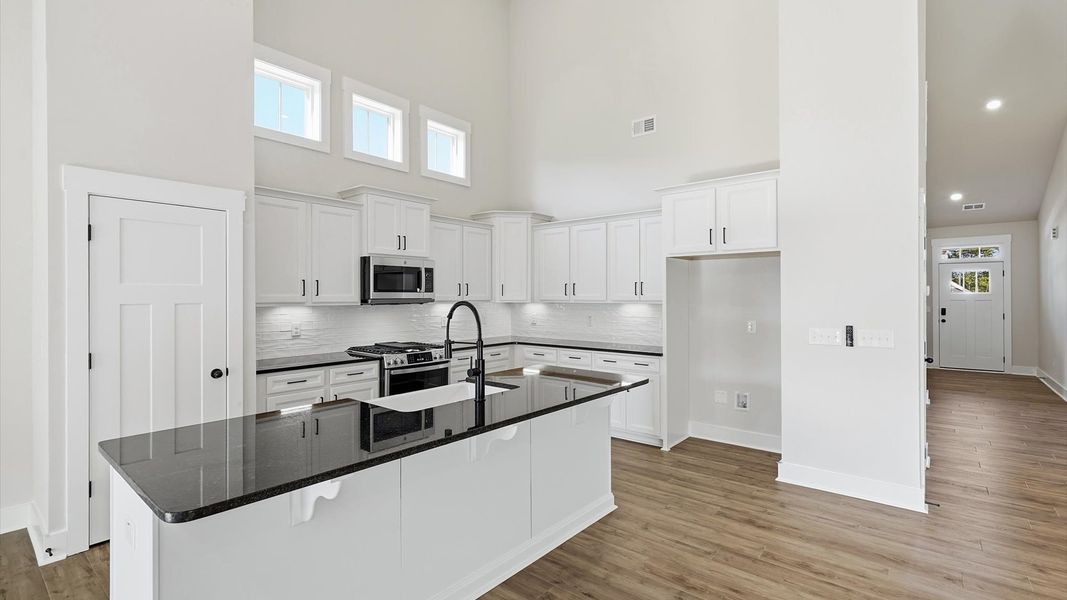 First-class finishes and a thoughtfully scaled island highlight this elegant kitchen space
