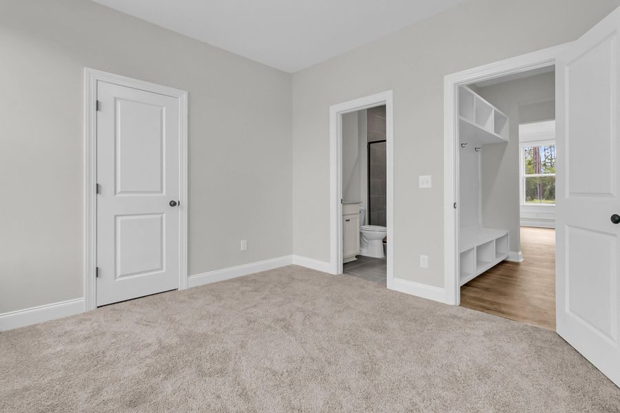 Spacious, unfurnished interior of a new home in Tidewater at Lakes of Cane Bay, Summerville (Image 33).