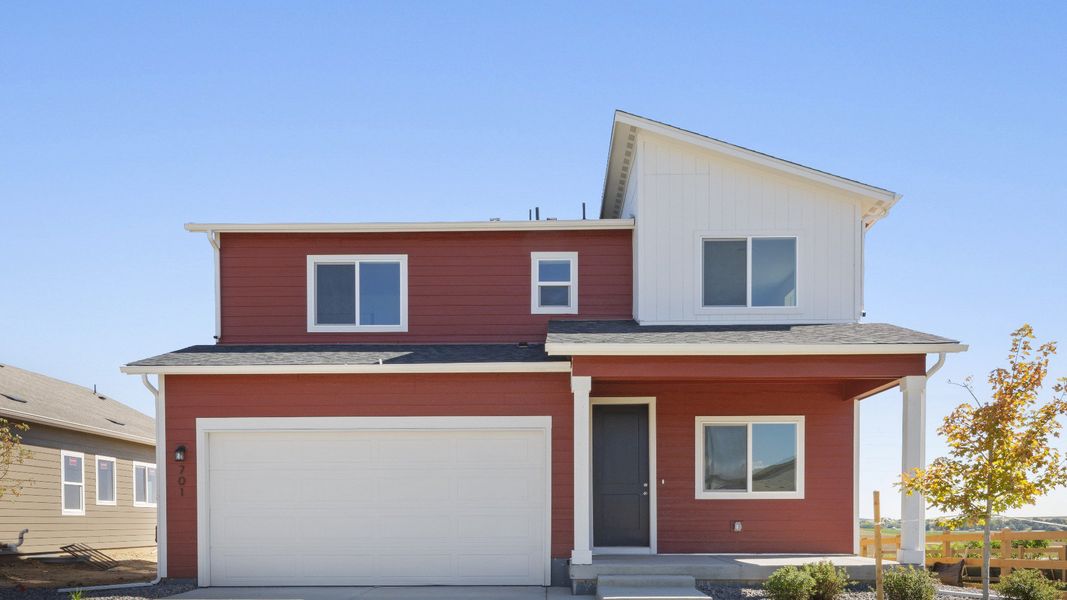Front exterior of a new home in Granary, Johnstown, CO, highlighting curb appeal (Image 1). Front exterior of a new home in Granary, Johnstown, CO, highlighting curb appeal (Image 1).