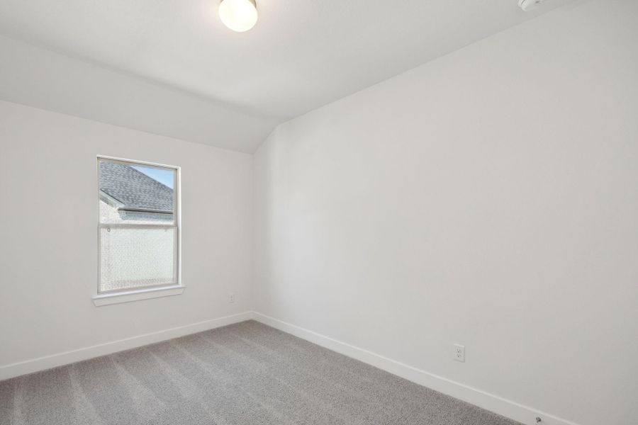 The fourth bedroom offers a generous and inviting retreat that is perfect if you're looking for comfort and versatility.