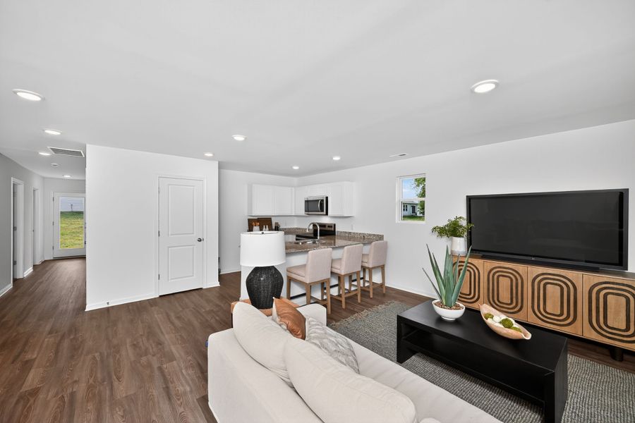 A living room with a tv and couches.