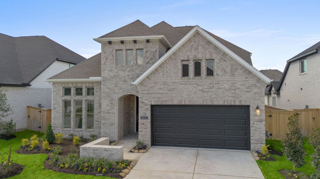 Front exterior of a new home in Bridgeland 55', Cypress, TX, highlighting curb appeal (Image 20).