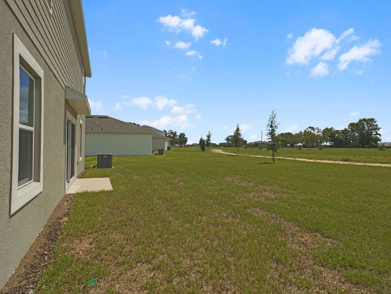 Representative exterior photo of a completed home built from the Azalea by Taylor Morrison in Scenic Terrace, Lake Hamilton, FL (Image 26).