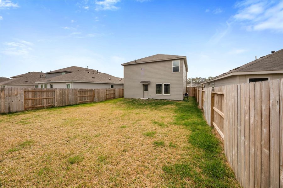 Exterior details and patio area of a home in , New Caney (Image 24).