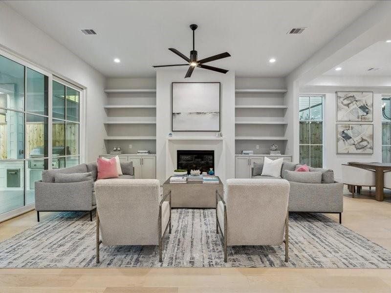 View of Living room with custom built in shelves