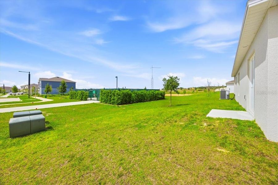 Exterior details and patio area of a home in Hunt Club Groves, Lake Wales (Image 4).