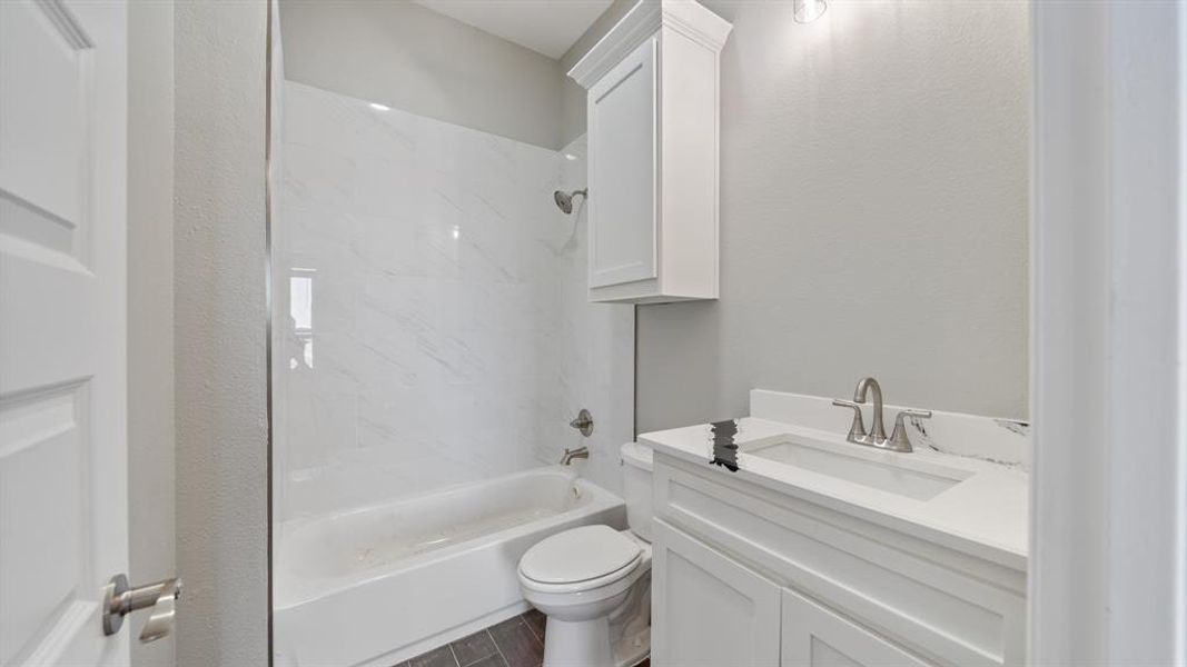 Full bathroom with shower / washtub combination, vanity, and toilet