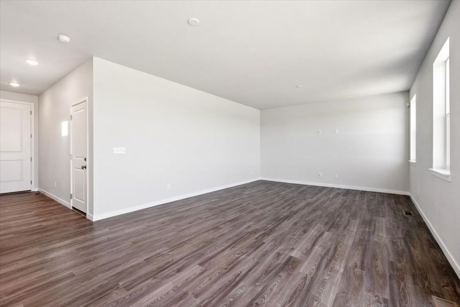 A room with wood floors.
