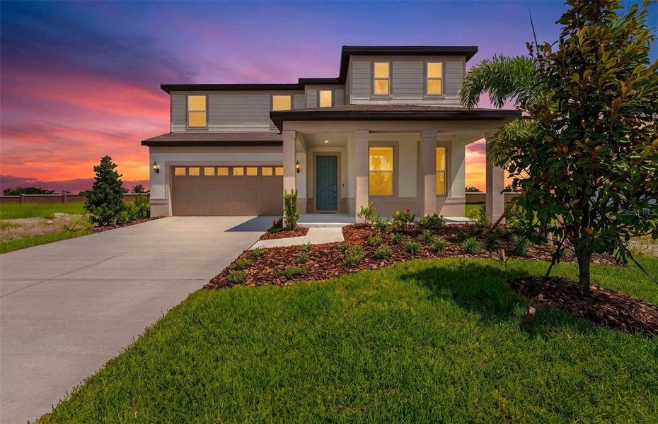 Front exterior of a new home in Seaire, Parrish, FL, highlighting curb appeal (Image 2). Front exterior of a new home in Seaire, Parrish, FL, highlighting curb appeal (Image 2).