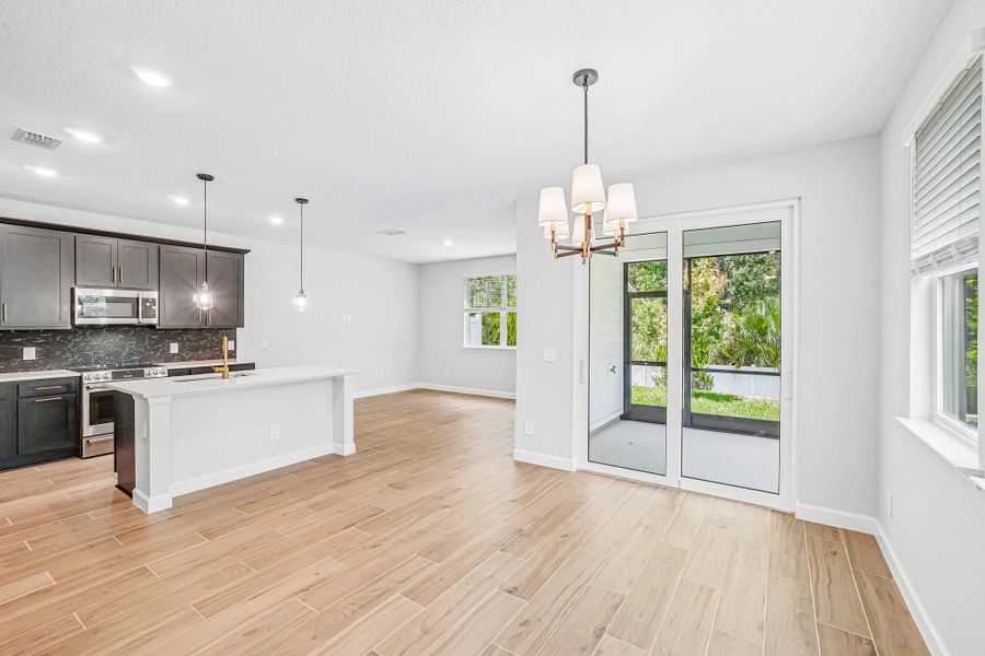 as you walk down the foyer you enter into the open dining, kitchen and family room spaces as you walk down the foyer you enter into the open dining, kitchen and family room spaces
