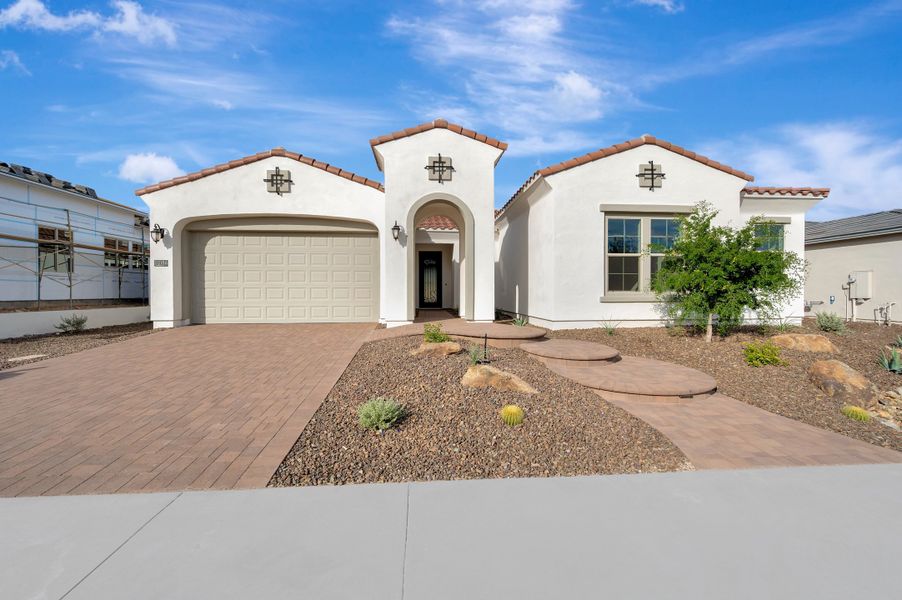 Front exterior of a new home in Canyon Views – 70’ Sunrise Series, Litchfield Park, AZ, highlighting curb appeal (Image 1). Front exterior of a new home in Canyon Views – 70’ Sunrise Series, Litchfield Park, AZ, highlighting curb appeal (Image 1).