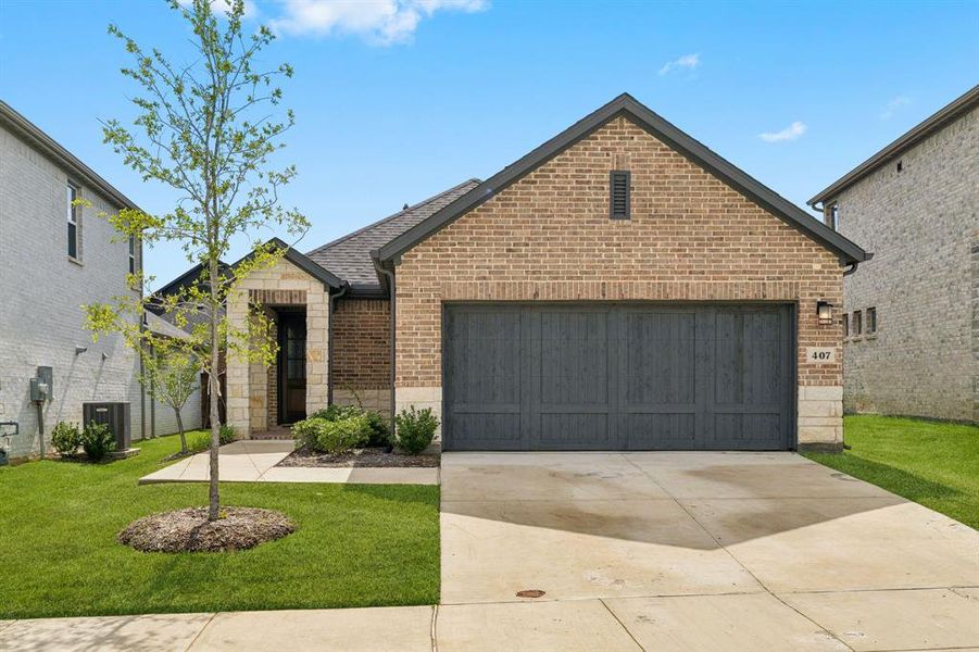 Front exterior of a new home in South Oak, Oak Point, TX, highlighting curb appeal (Image 2). Front exterior of a new home in South Oak, Oak Point, TX, highlighting curb appeal (Image 2).