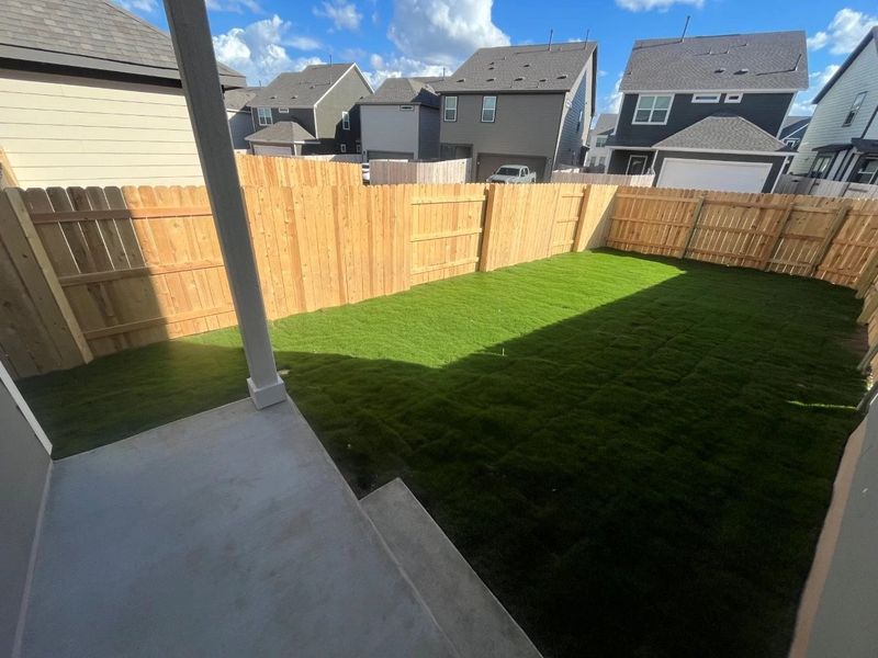 Exterior details and patio area of a home in Lariat, Liberty Hill (Image 16).