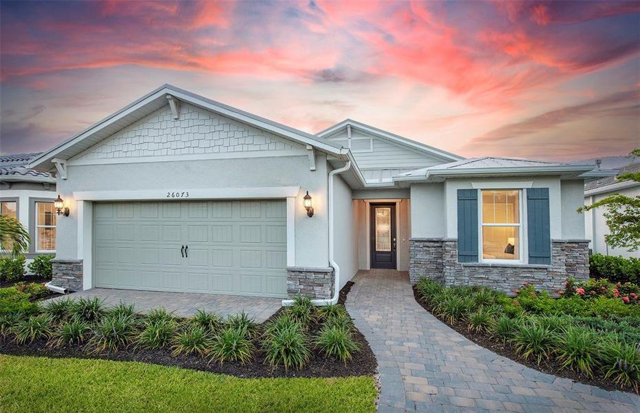 Front exterior of a new home in BeachWalk by Manasota Key, Englewood, FL, highlighting curb appeal (Image 1). Front exterior of a new home in BeachWalk by Manasota Key, Englewood, FL, highlighting curb appeal (Image 1).