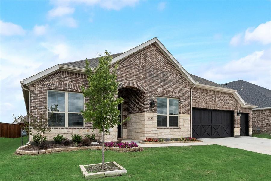 Front exterior of a new home in Sutton Fields, Celina, TX, highlighting curb appeal (Image 20).