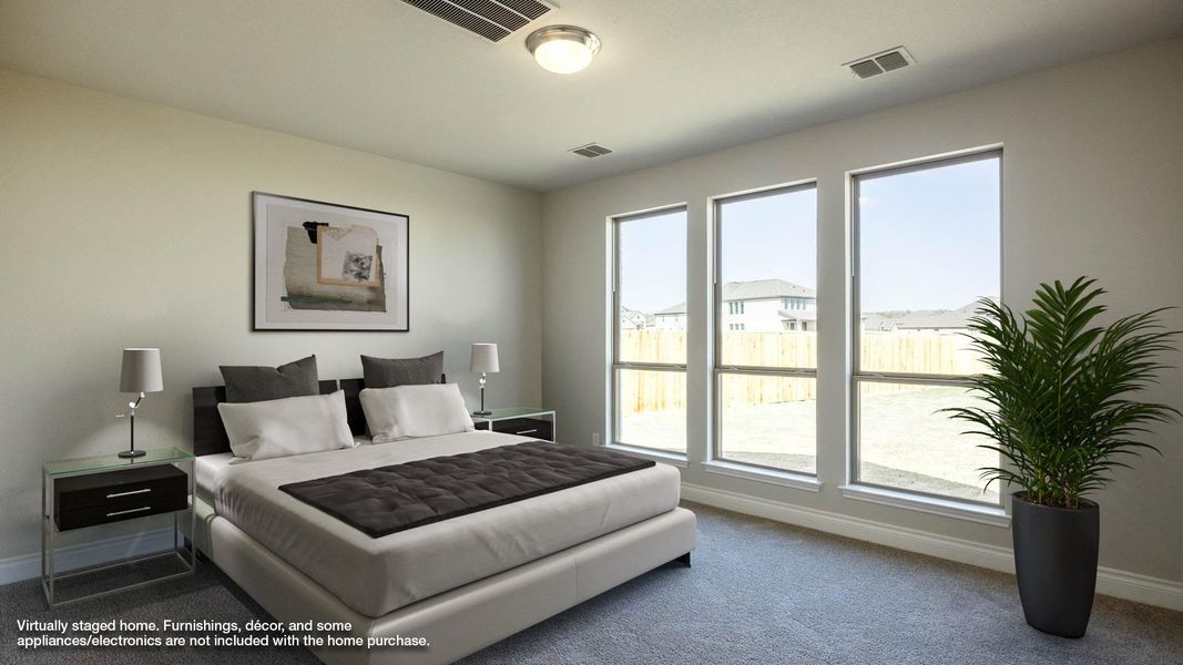 Bedroom featuring baseboards, visible vents, and carpet floors Bedroom featuring baseboards, visible vents, and carpet floors