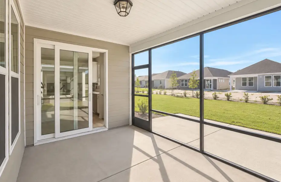 Exterior details and patio area of a home in Del Webb Wilmington at Mallory Creek, Leland (Image 24).