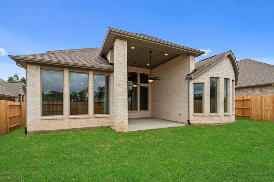 Exterior details and patio area of a home in Wildtree, Magnolia (Image 23).