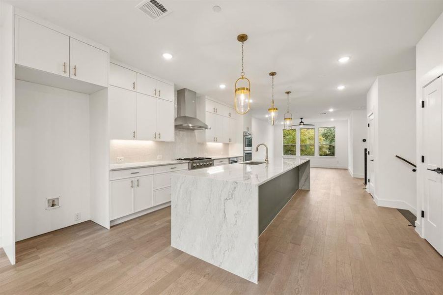 Situated between the dining room and family room, this over the top kitchen is an entertainers dream! Situated between the dining room and family room, this over the top kitchen is an entertainers dream!