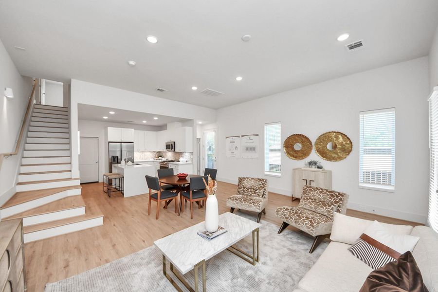 Appreciate here the staging of this living & dining area, with large windows allowing a grandiose view. Appreciate here the staging of this living & dining area, with large windows allowing a grandiose view.