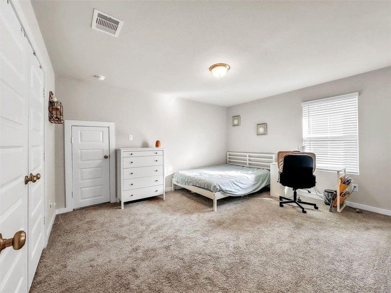 Well-sized secondary bedrooms with ample closet space and neutral finishes, complemented by clean and modern full bathrooms.