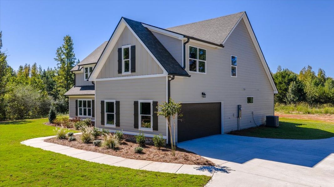 Front exterior of a new home in Collier Grove, Thomaston, GA, highlighting curb appeal (Image 2). Front exterior of a new home in Collier Grove, Thomaston, GA, highlighting curb appeal (Image 2).