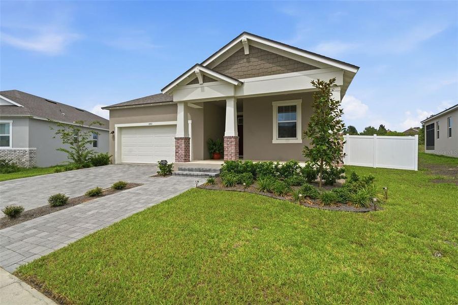 Front exterior of a new home in , Clermont, FL, highlighting curb appeal (Image 22).