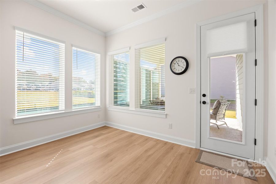 AREA OFF THE LIVING ROOM LOOKING OUT ON THE COVERED PORCH