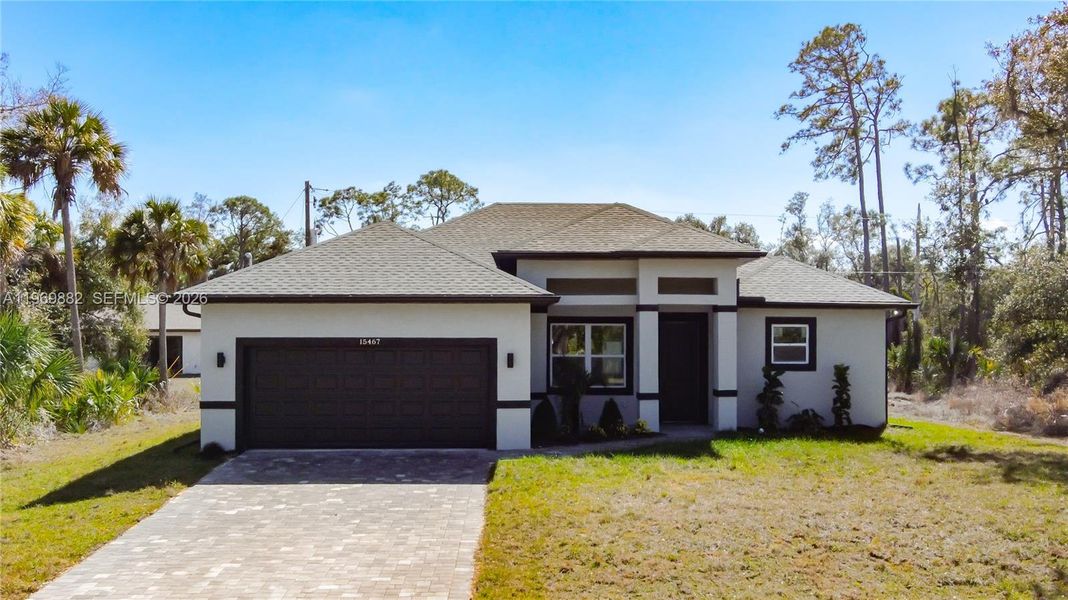 Front exterior of a new home in , Port Charlotte, FL, highlighting curb appeal (Image 25).
