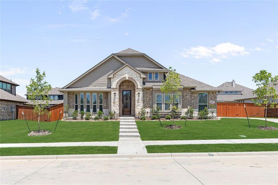 Front exterior of a new home in Hayes Crossing, Midlothian, TX, highlighting curb appeal (Image 2).