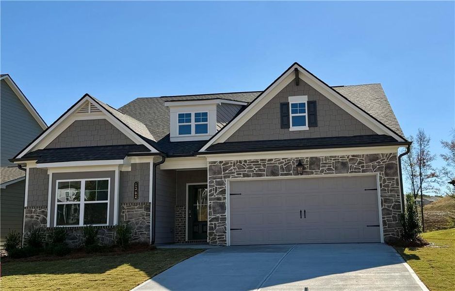 Front exterior of a new home in Ponderosa Farms Estates, Gainesville, GA, highlighting curb appeal (Image 1).