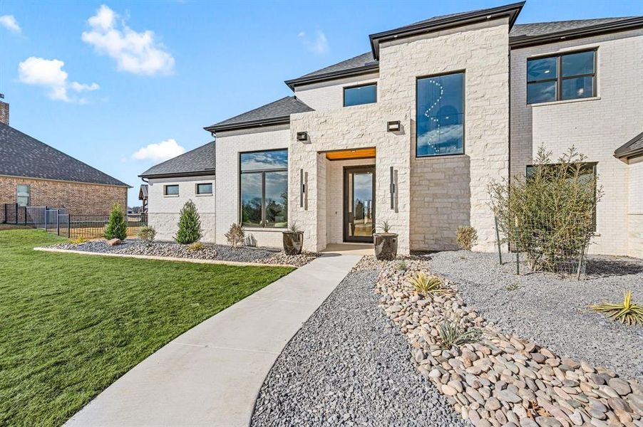 Exterior details and patio area of a home in , Pelican Bay (Image 3).