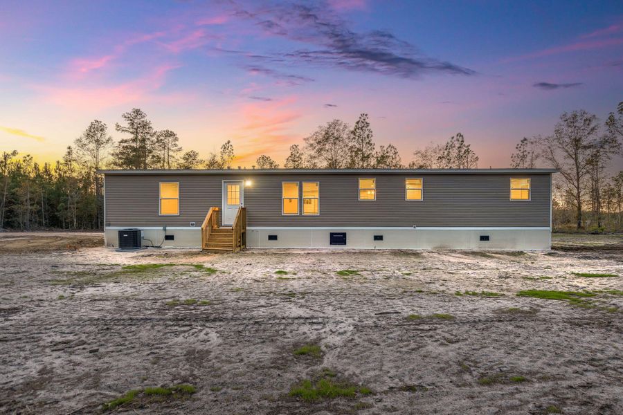 Exterior details and patio area of a home in , Cottageville (Image 24).